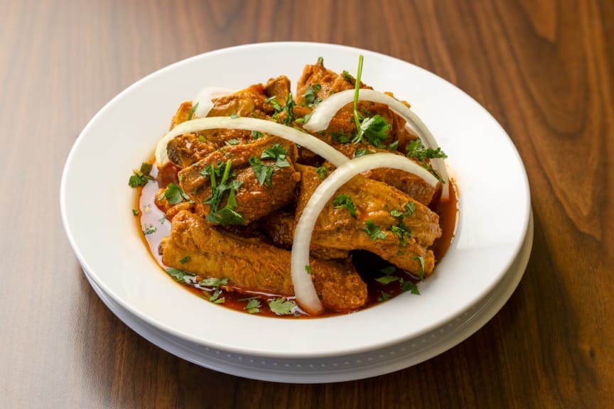 Crispy green plantain tostones with garlic sauce
